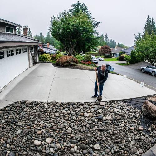  | A new "broom finish" concrete driveway with an Allan Block Wall (Rocky Mountain Blend, Ashlar Pattern) and some beautiful river rock to tie it all in. | Concrete Driveways 