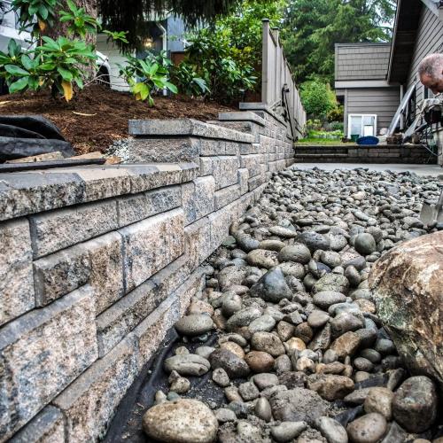  | Don Moore work on an Allan Block Wall (Rocky Mountain Blend, Ashlar Pattern) and some beautiful river rock to tie it all in. | Retaining Walls & Borders - Design and Installation 