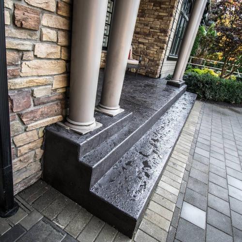  | Front entrance stairs with texture finish, charcoal integral color and black release powder. | Concrete and Stone Stairs 