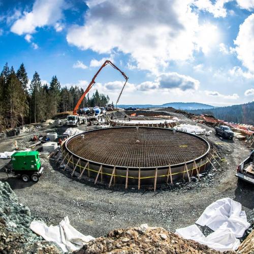  | Water reservoir tanks base construction project in Langford, BC. There are two side by side tanks measuring 67ft in diameter each. The concrete base tolerance capacity is for a tank that holds 1,000,000 gallons water each. We are prepping and pouring grade beams and thicken slabs for both tanks approximately 250 cubic meters of concrete per tank base. | Concrete Form Work and Foundations 